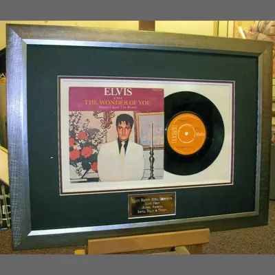 Elvis vinyl single and sleeve framed with an engraved plaque framed by Tripps of Keynsham