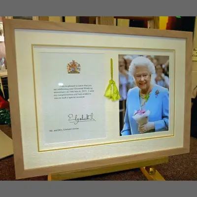 Royal congratulations letter and photograph in a gold frame framed by Tripps of Keynsham