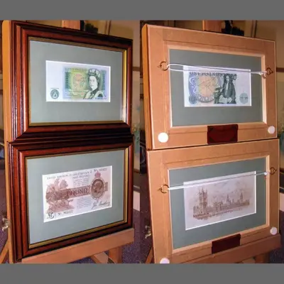 Banknotes framed in pairs with wooden mouldings framed by Tripps of Keynsham