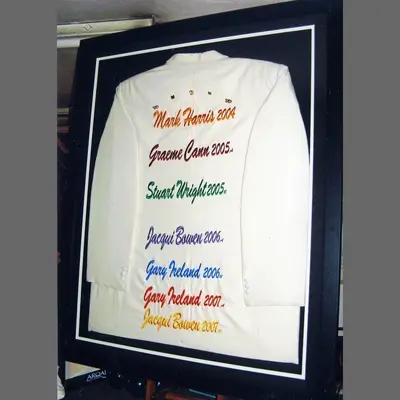 White shirt with handwritten names framed in navy framed by Tripps of Keynsham
