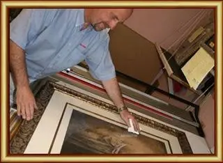 Picture framer at work in the Tripps of Keynsham workshop